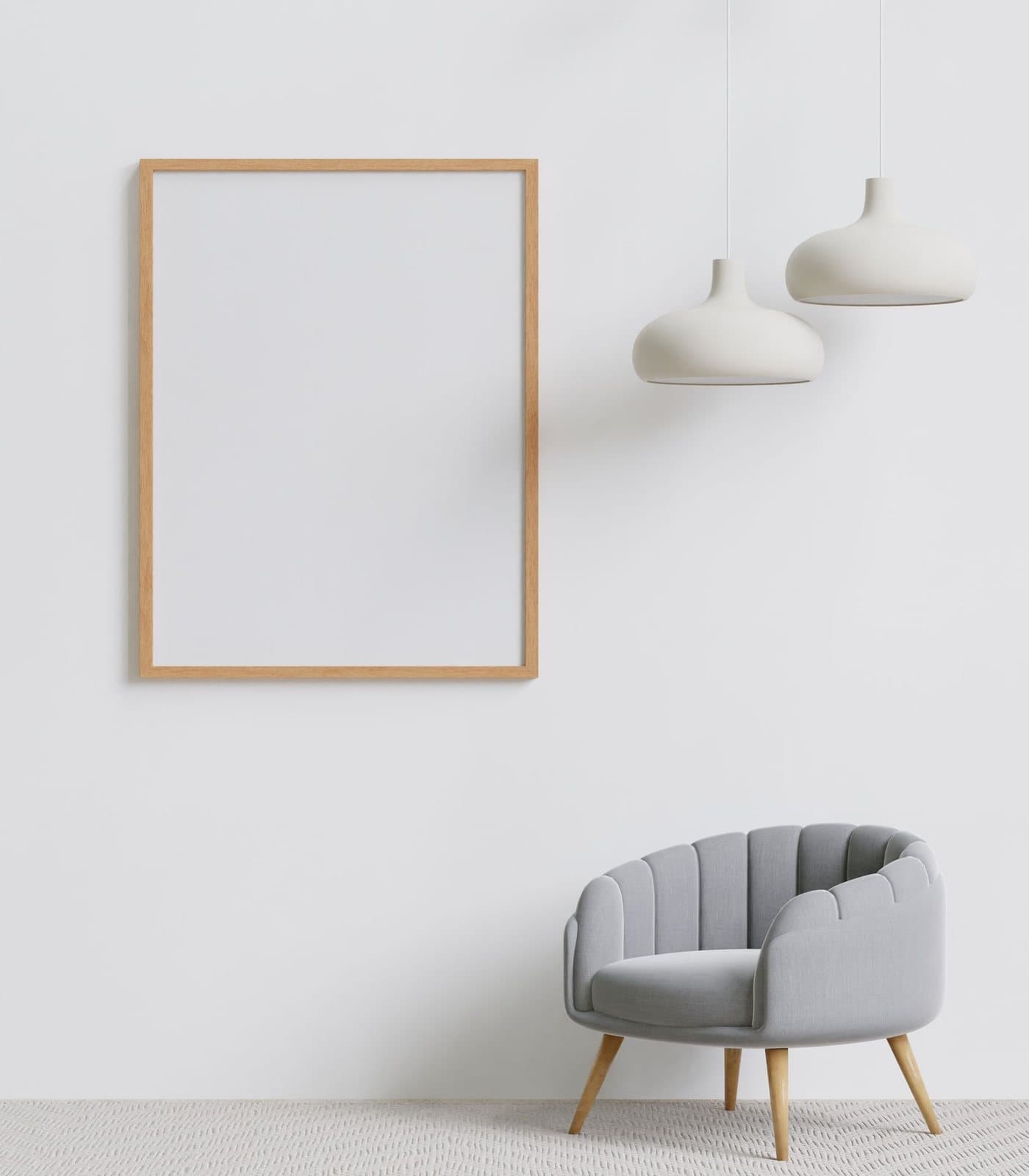 An empty room with a single armchair and a blank picture frame
