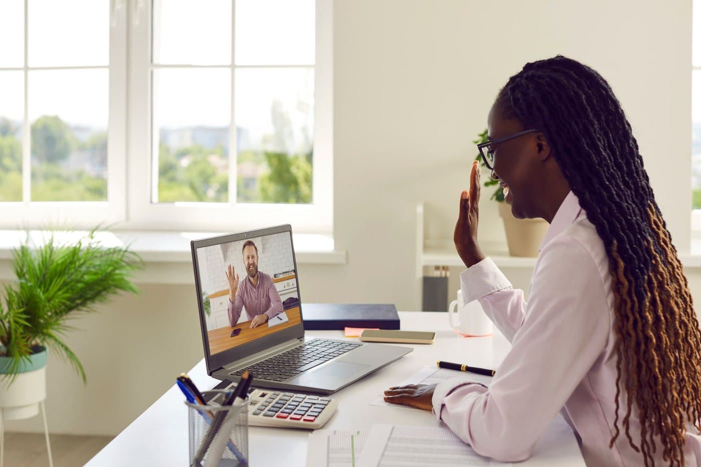 Person at a desk during a telehealth therapy appointment