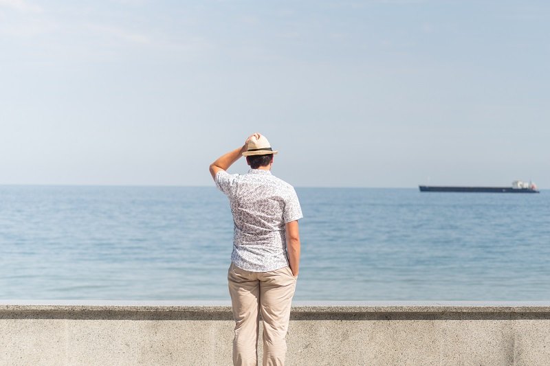 young-man-in-summer-clothes-standing-on-a-pier-se-2025-03-31-05-44-08-utc young-man-in-summer-clothes-standing-on-a-pier-se-2025-03-31-05-44-08-utc